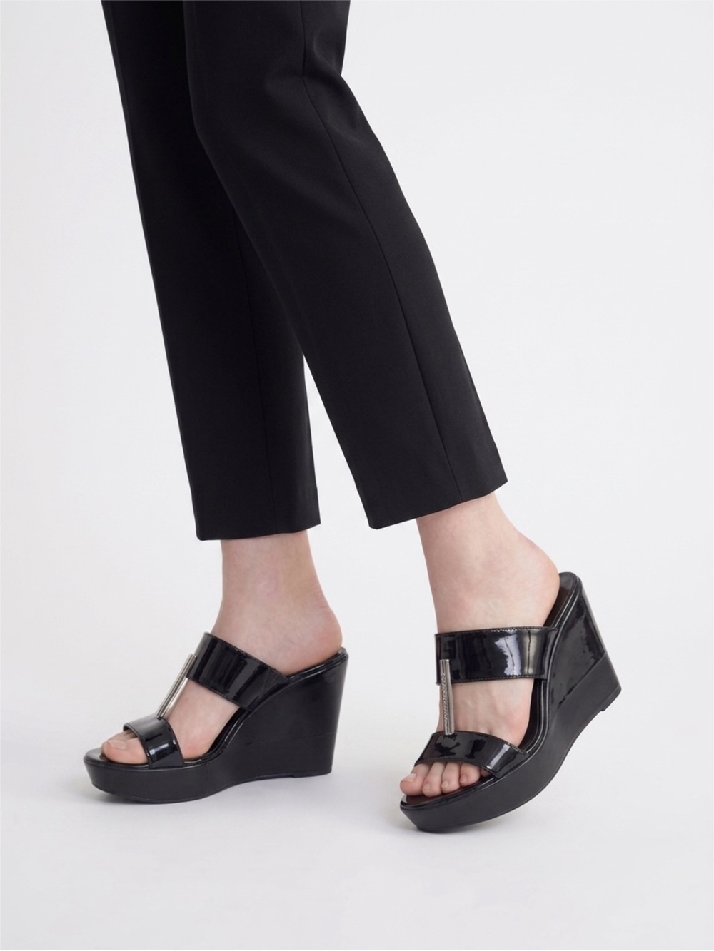 BCBGeneration Black Wedge Slide Sandals with Metallic Accent